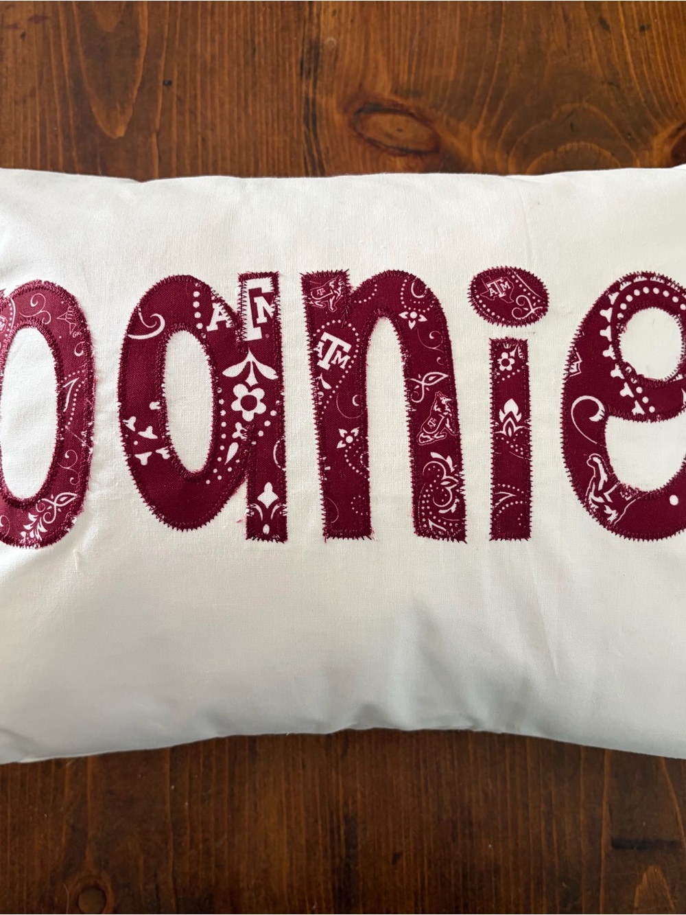 White Accent Pillow with Maroon Appliqué Daniel